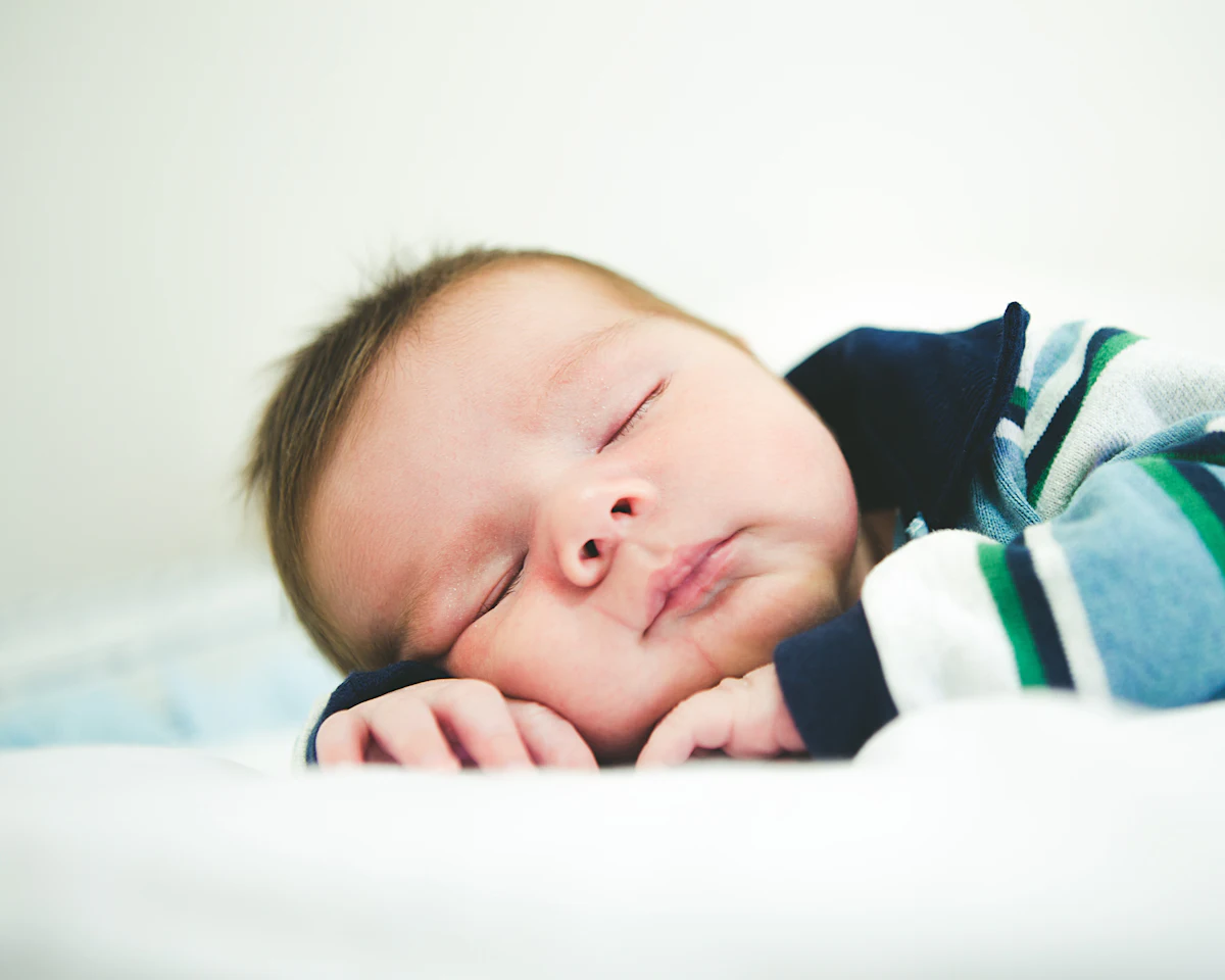 A baby boy sleeping peacefully