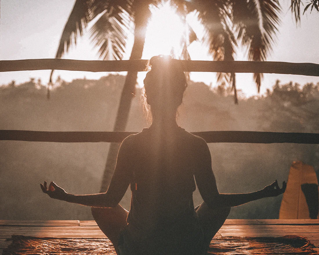 A woman sitting calmly doing breathing exercises