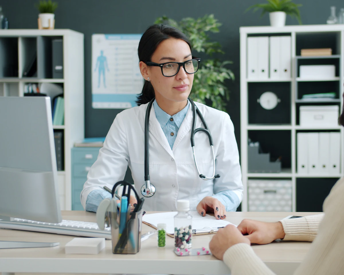 A female doctor talking with a patient